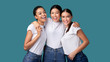 © Prostock-studio - Three Happy Diverse Girls Hugging On Turquoise Studio Background, Panorama