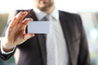 © H_Ko - Male arm in suit give blank calling card to visitor closeup. White collar colleagues company name exchange job interview sale clerk id executive or ceo finance support formal identity concept