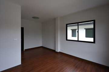 Wall Mural - interior design empty white room with glass window and wooden laminate floor of a new residential house