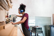 © mavoimages - Female artisan cutting wood in her framing studio