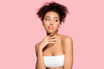 Wall Mural - portrait of attractive african american girl with clean face, isolated on pink