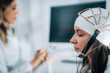 © Microgen - Female Patient in a Neurology Lab doing EEG Scan