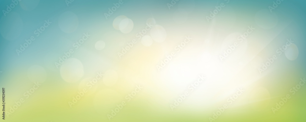 A fresh spring blue sunny sky background with blurred warm sunny glow. - obrazy, fototapety, plakaty 