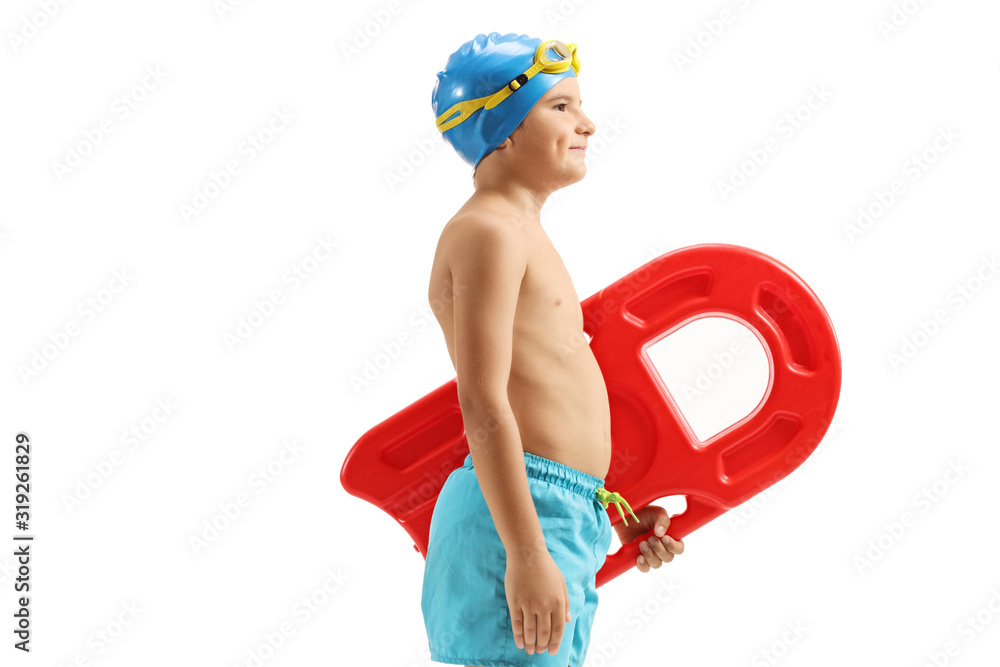 Boy in swimming trunks holding a swimming board - obrazy, fototapety, plakaty 