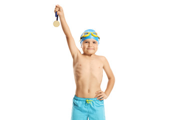 Wall Mural - Winner swimmer child holding a gold medal