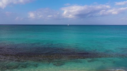 Wall Mural - aerial drone footage of seven mile beach, west bay and george town on the island of grand cayman in the cayman islands in the clear blue and green tropical waters of the caribbean sea