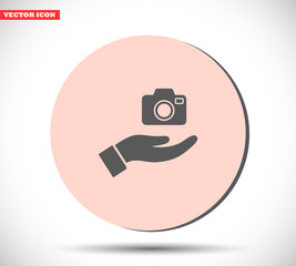 Camera in hand icon , lorem ipsum Flat design