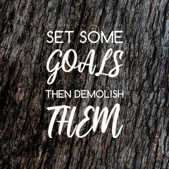 Wall Mural - Motivation and inspirational quotes - Set some goals the demolish them. Blurry background.