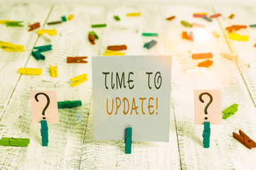 Wall Mural - Writing note showing Time To Update. Business concept for act updating something someone or updated version program Crumbling sheet with paper clips placed on the wooden table