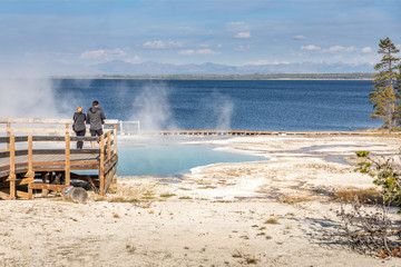 Toursts on the boardwalk at West Thumb Geyser Basin, Yellowstone National Park