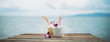 fruit cocktails decorated with orchids on the table of the beach bar against the background of the sea. Healthy drinks