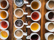 © Diego - Tasting of different types of coffee and natural teas (ginger, vainilla) on a wooden background in Bali, Indonesia