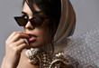Portrait of young beautiful sexy brunette woman in white stylish hood, sunglasses and accessories