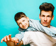 © iordani - young pretty man model with little cute son playing together, lifestyle modern people concept, family male