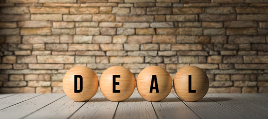 Wall Mural - wooden balls with the word DEAL in front of a brick wall