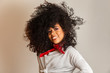 © Brastock Images - Beauty portrait of african american woman with afro hairstyle and glamour makeup. Brazilian woman. Mixed race. Curly hair. Hair style. White background.