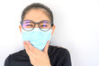 © boyloso - Close up of young Asian woman coughing and wearing mask for protect bad air pollution. Air pollution has been associated with diseases of the heart and lungs, cancers and other health problems.