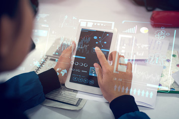 Wall Mural - business woman hand working on blank screen laptop computer on wooden desk as concept with social media diagram