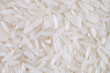 © otello-stpdc - Close-up of white rice seed texture background. Organic, natural long rice grain, food for healthy. Agriculture of culture asian. Top view