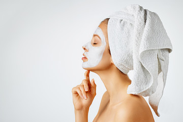 Wall Mural - cosmetology, skin care, face treatment, spa and natural beauty concept. woman with facial mask.