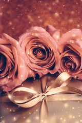 Wall Mural - Luxury holiday golden gift box and bouquet of roses as Christmas, Valentines Day or birthday present