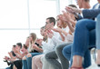 © ASDF - background image of young people applauding in the conference room