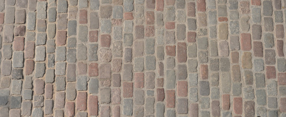 Old cobblestone pavement top view