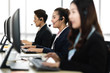 © Art_Photo - Group of happy smiling business operator customer support team phone services working with headset and computer at call center