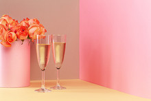 Two Glasses With Champagne And And Bouquet Of Roses