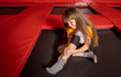 © leszekglasner - Child girl suffering from pain in ankle after jumping on trampoline