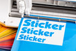 production making sticker with plotter cutting machine cyan blue colored vinyl fim with color fan. guide. Advertising Industry diy design concept background.