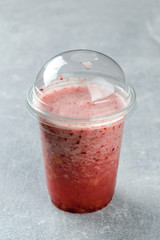 Poster - raspberry smoothie in a plastic takeaway glass