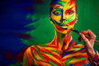 © Mike Orlov - Color art face and body painting on woman for inspiration. Abstract portrait of the bright beautiful girl with colorful make-up and bodyart.