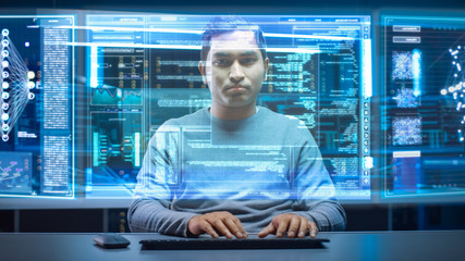 Fototapete - Portrait of Software Developer / Hacker Wearing Glasses Sitting at His Desk and Working on Futuristic Transparent Computer in Digital Identity Cyber Security Data Center. Hacking or Programming.