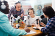 © JackF - Multinational group of cheerful young adults emotionally discussing in radio studio