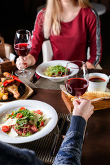 Wall Mural - lovers man and woman drink wine in a restaurant