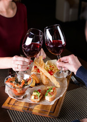 Wall Mural - lovers man and woman drink wine in a restaurant