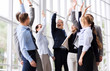 © Syda Productions - corporate and teamwork concept - happy business team making high five or celebrating success at office