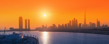 Panoramic View Of All Skyscrapers From Dubai Creek Sea Bay At Golden Hour Sunset. City Life In The UAE Concept