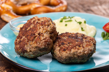 two bavarian meat loafs on a plate