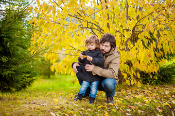 Father and daughter walking together, autumn day