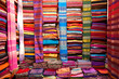 © Tandem Stock - A colorful wall of fabric at a fabric shop in Fes el-Bali, Fes, Morocco.