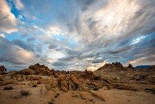 Dramatic Clouds Are Illuminated Over The Alabama Hills At Sunrise In The Desert Of The Eastern Sierra Near Lone Pine, California.