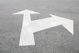 Fototapeta  - Asphalt road with arrows marking