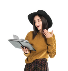 Canvas Print - Beautiful young woman reading book on white background