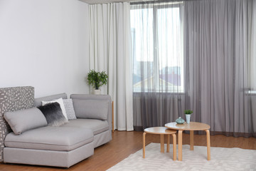 Wall Mural - Window with stylish curtains in living room interior