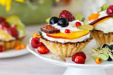 Poster - Colorful cupcakes and floral arrangement with sunflowers and hortensias