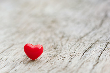 Canvas Print - Valentines Day concept -  Red hearts on plank wooden background with copy space.