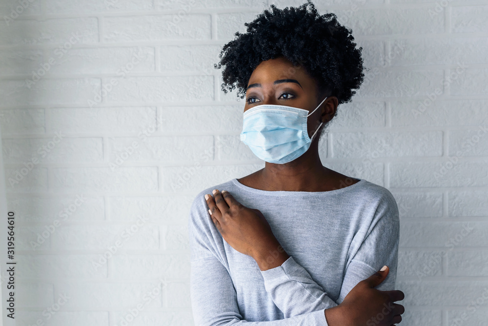Portrait of young African-American woman wearing disposable medical face mask - obrazy, fototapety, plakaty 