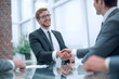 © ASDF - business partners greet each other at a business meeting.